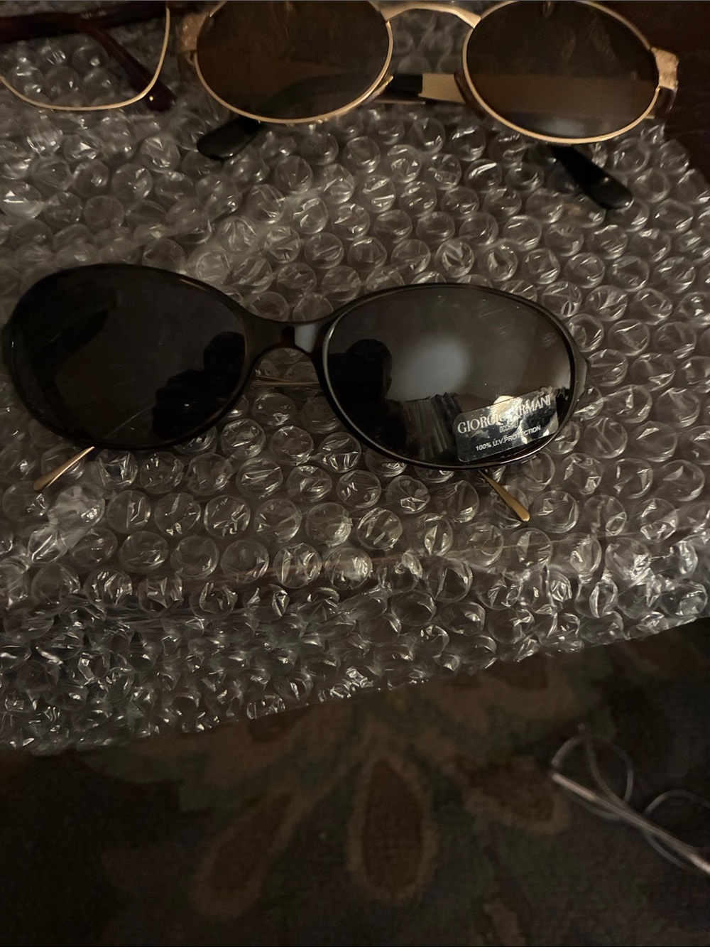 Vintage 90s y2k Giorgio Armani Women's Black Oval Sunglasses with Gold Temples